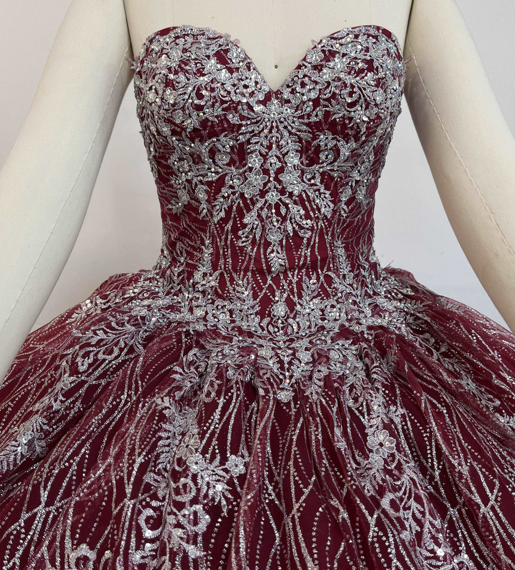 A beautiful gown, off-shoulder, reveals noble air.