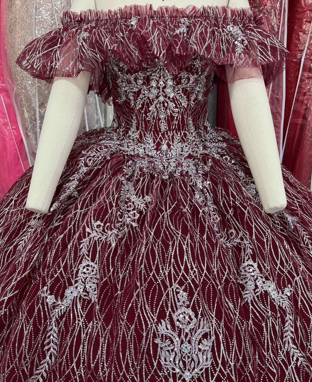 A beautiful gown, off-shoulder, reveals noble air.